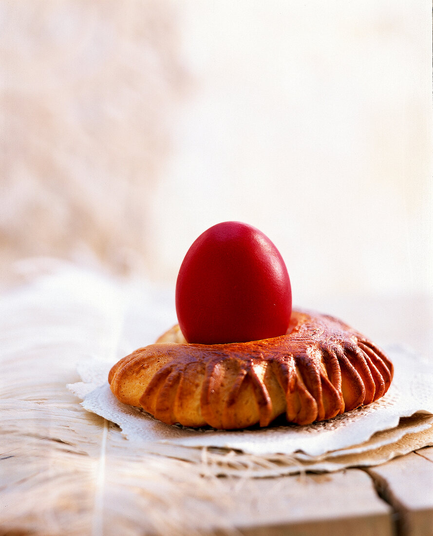 Close-up of red egg in bread wreath