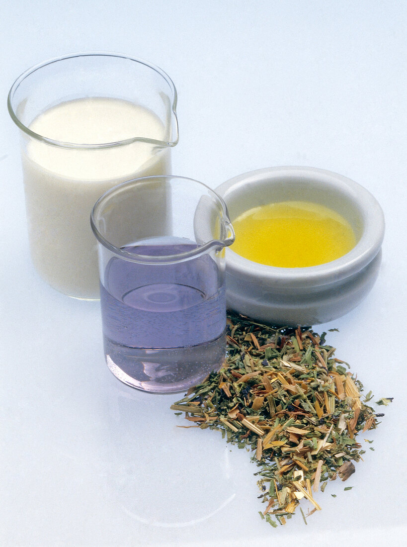 Ingredients for pansy lotion on white background