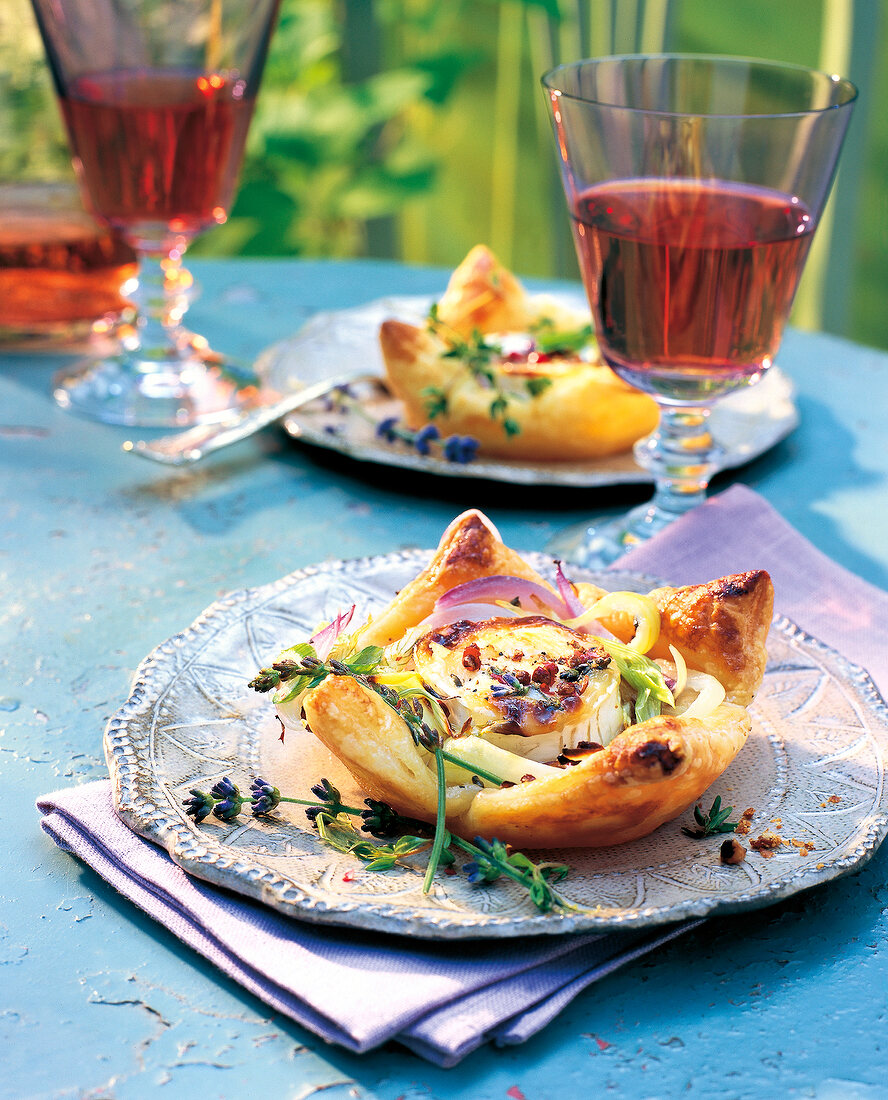 Pastry with goat cheese on sliver plate