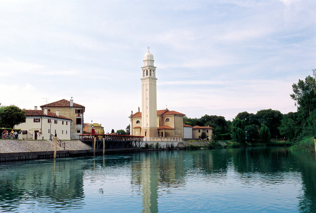 View of church beside river Sile Treviso, Italy