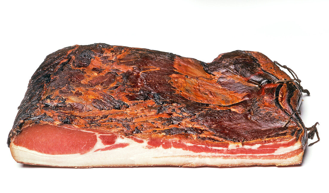 Close-up of Carinthian bacon on white background