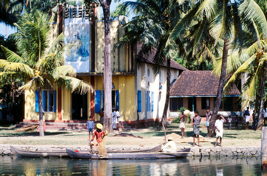 People at residential area near the river in South India