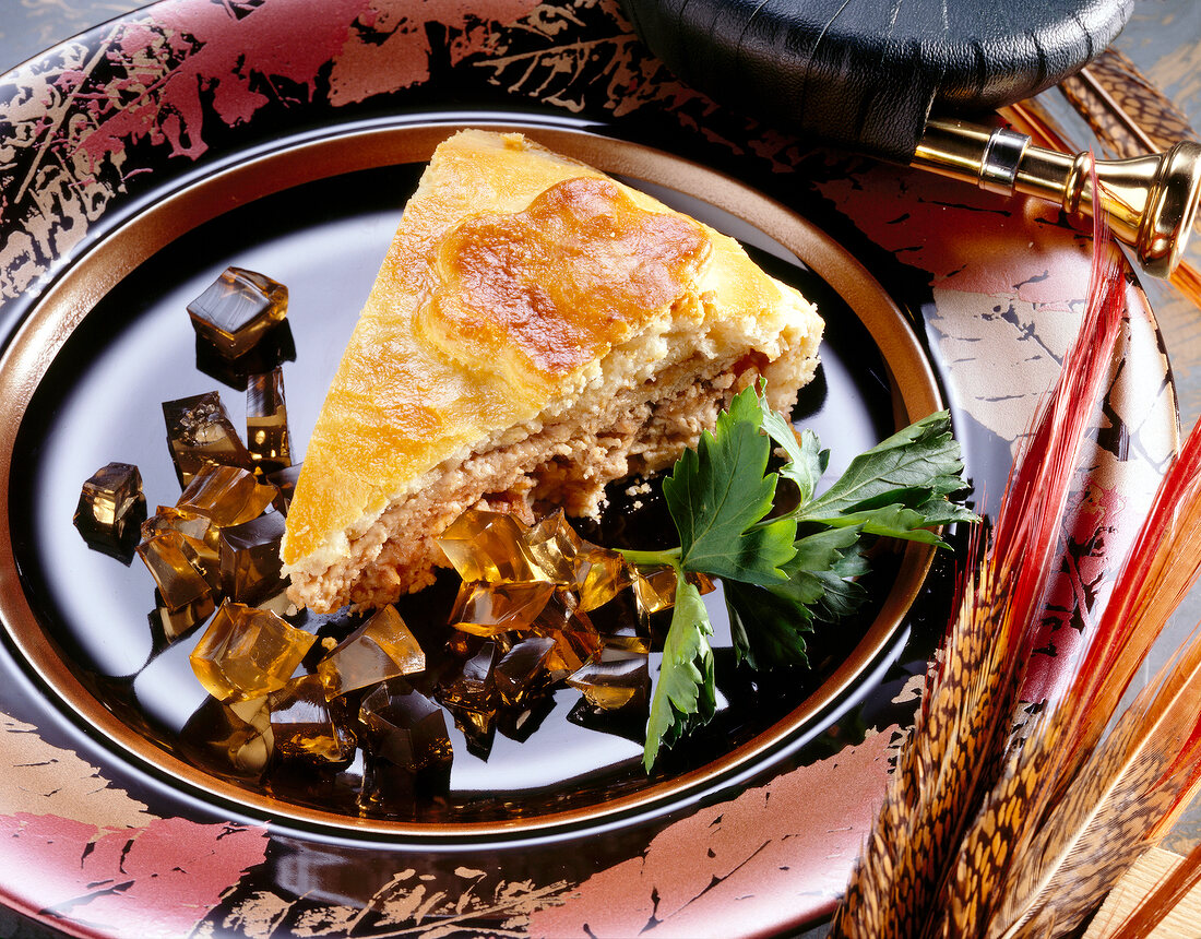 Saarbrucken meat pie with diced port wine jelly on plate