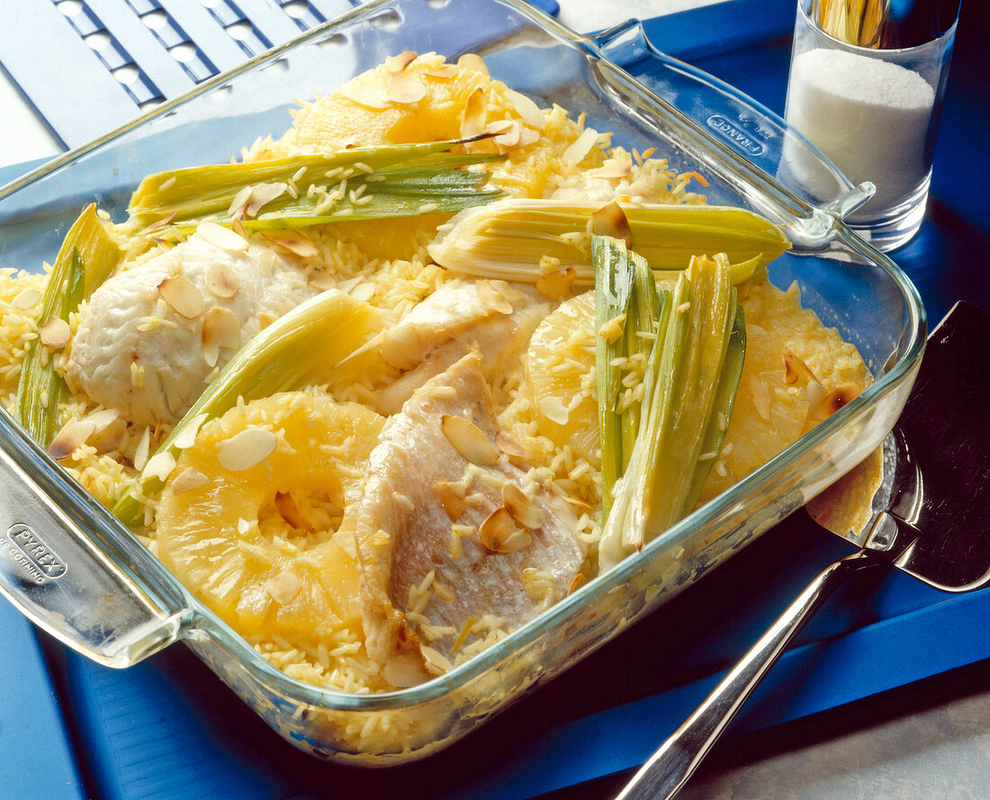 Rice-fish casserole with leek, pineapple, almonds and creme fraiche