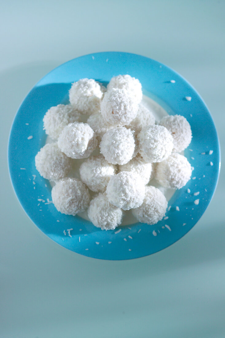 Ferrero Raffaello on blue plate, overhead view