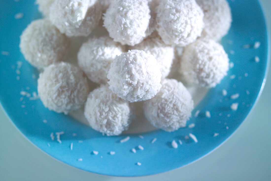 Ferrero Raffaello on blue plate, overhead view