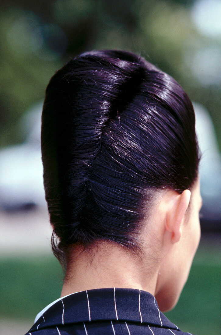 Rear view of dark haired woman with updo