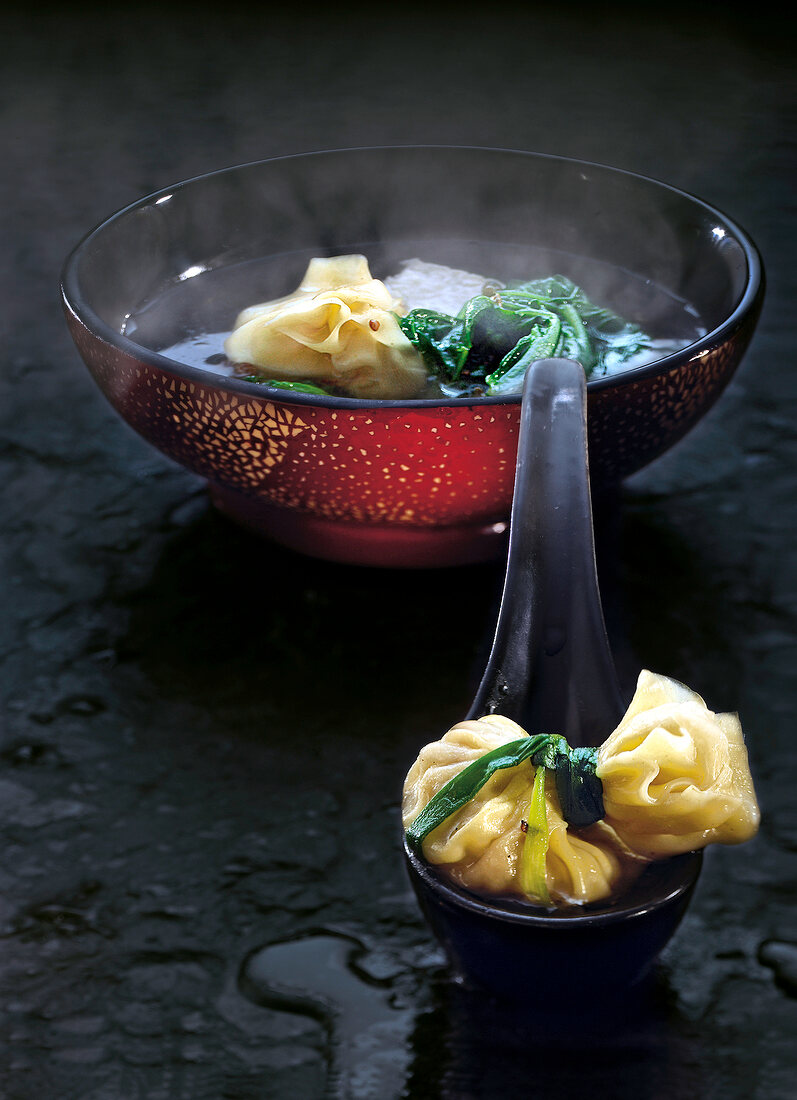 Chinese wonton soup in red bowl