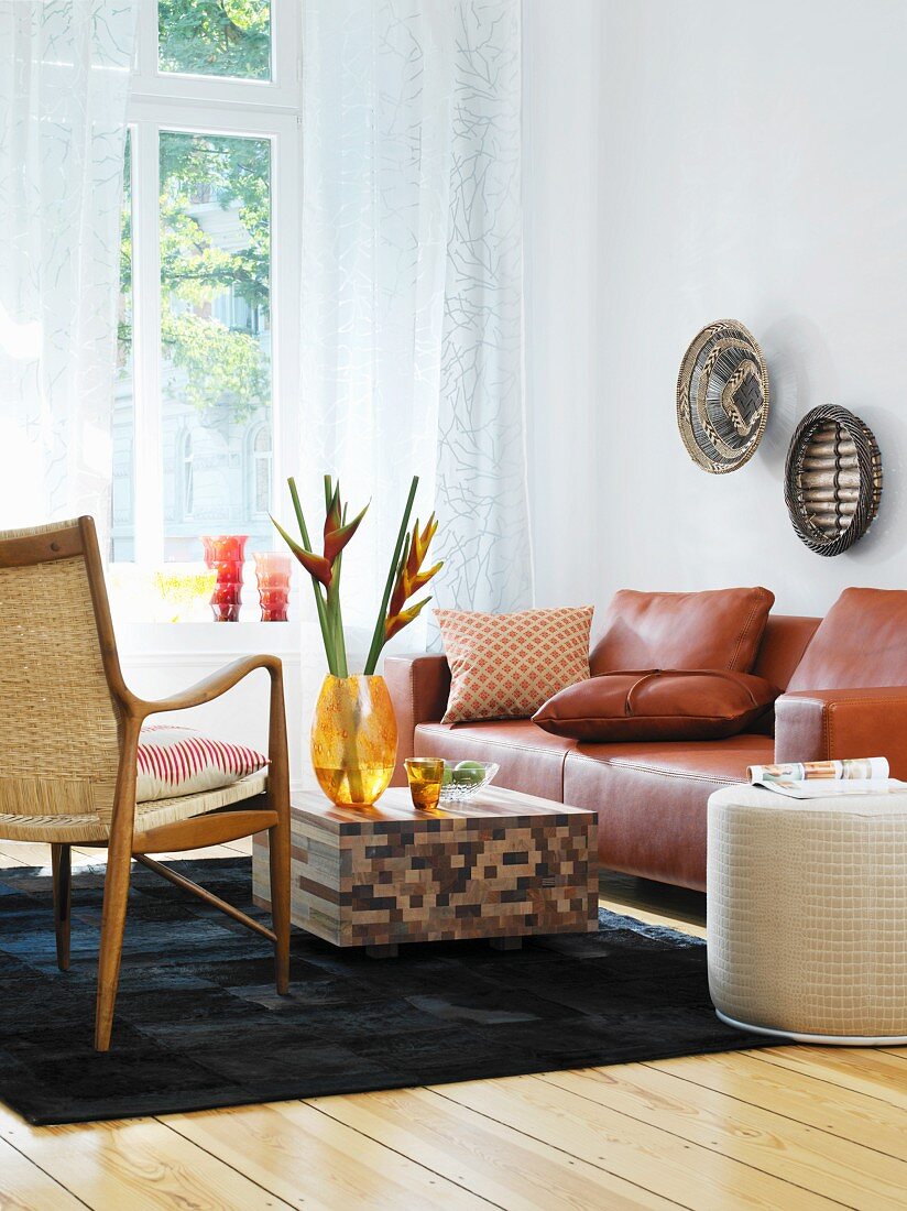 Leather sofa and coffee table made from three types of wood in living room