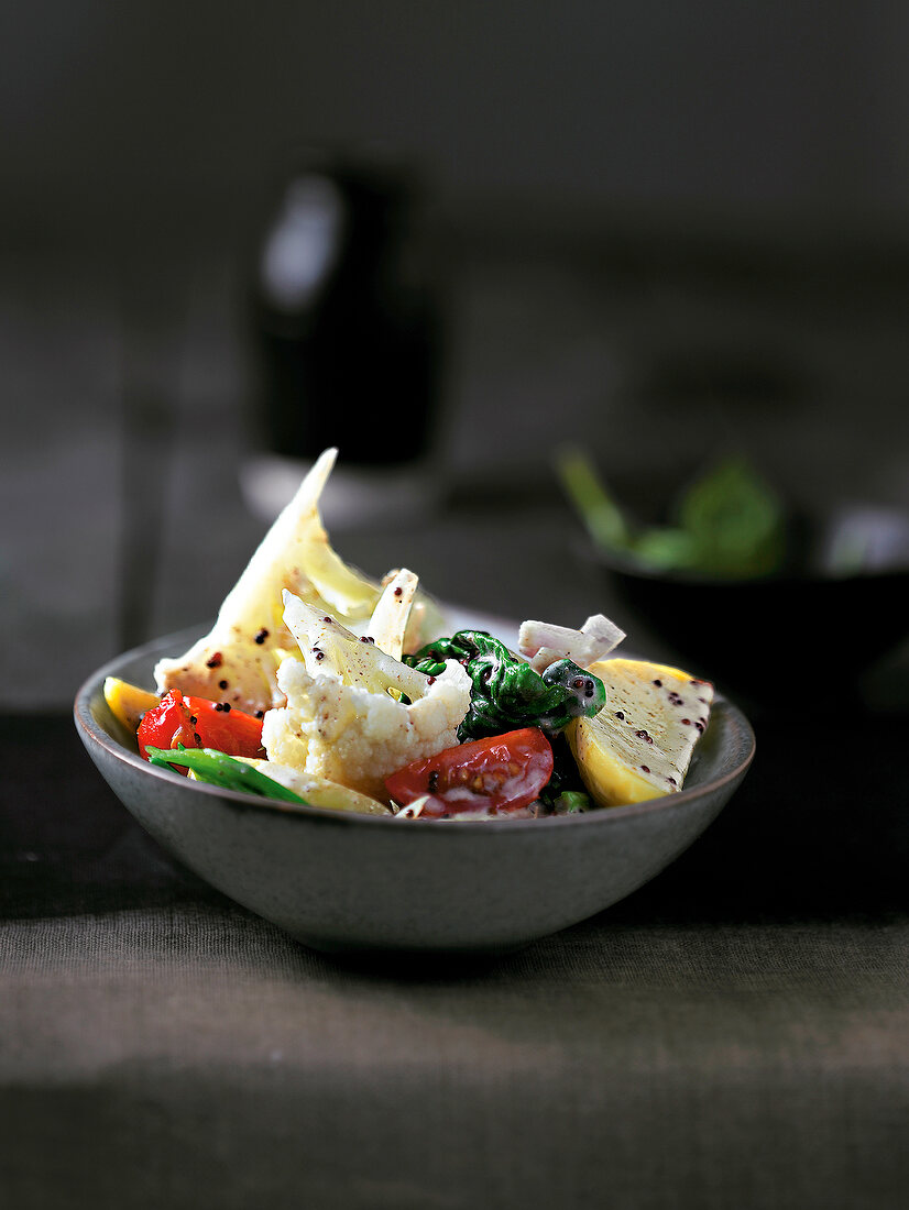 Potato curry with spinach in bowl