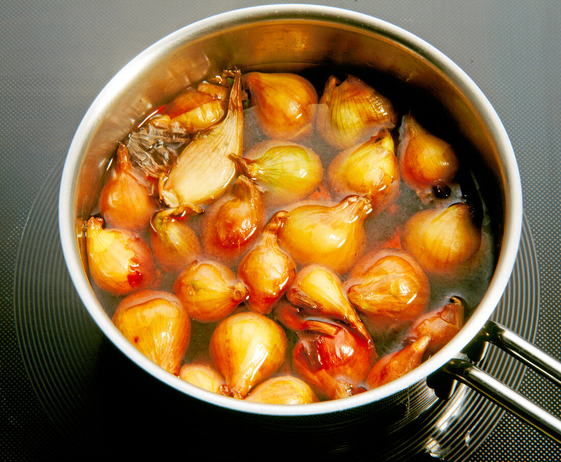 Close-up of onions being boiled in pan