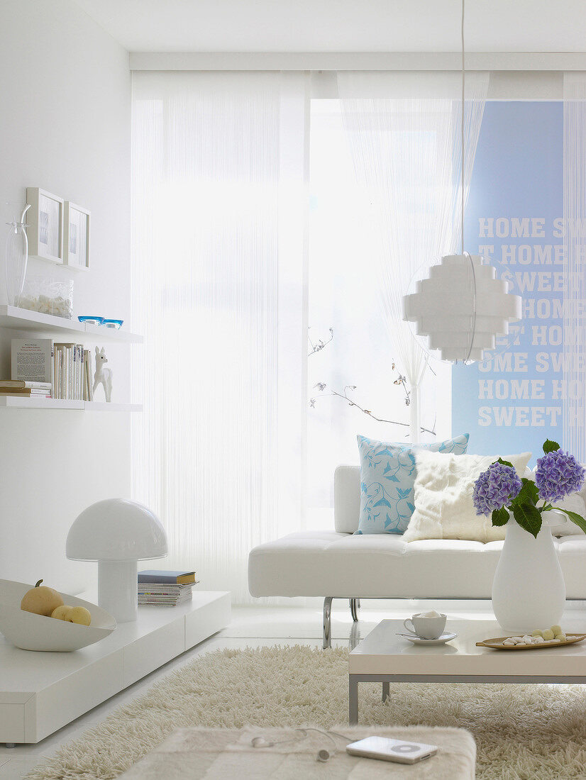 White furniture and walls with scripture in living room