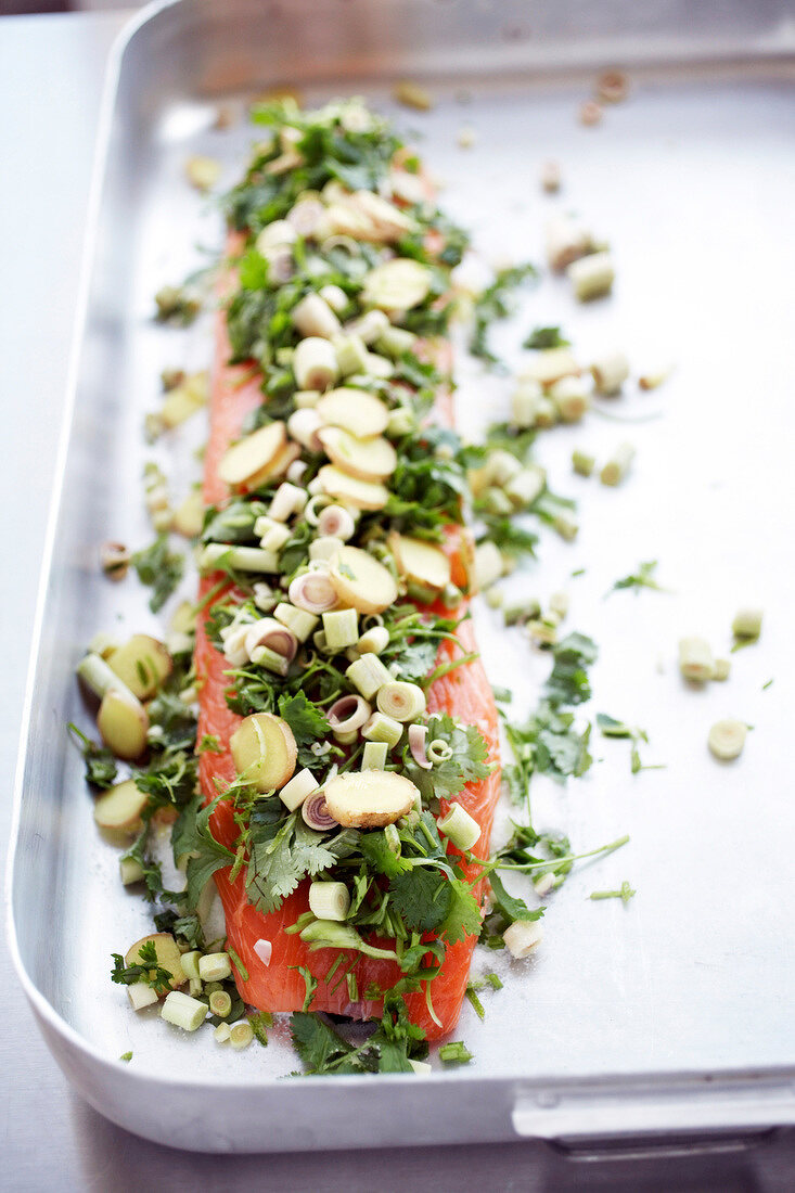 Salmon fillet with lemon grass and ginger pickle on baking tray