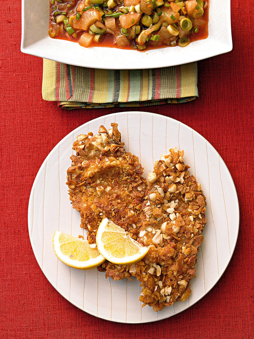 Turkey escalope with peanut crust on plate