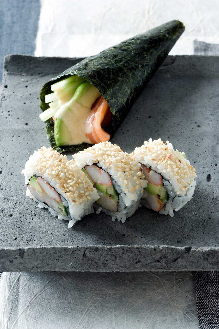 Asian temaki-wrap and inside-out sushi with sesame seeds