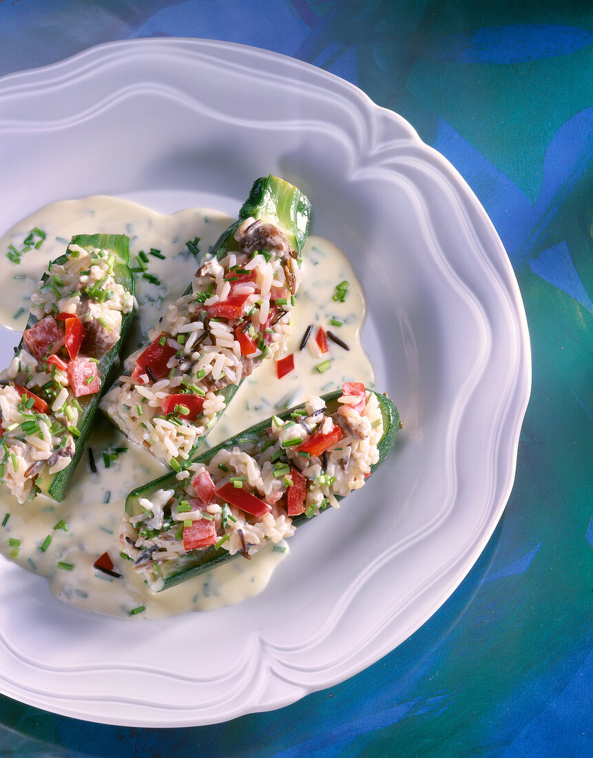 Stuffed zucchini on plate, overhead view