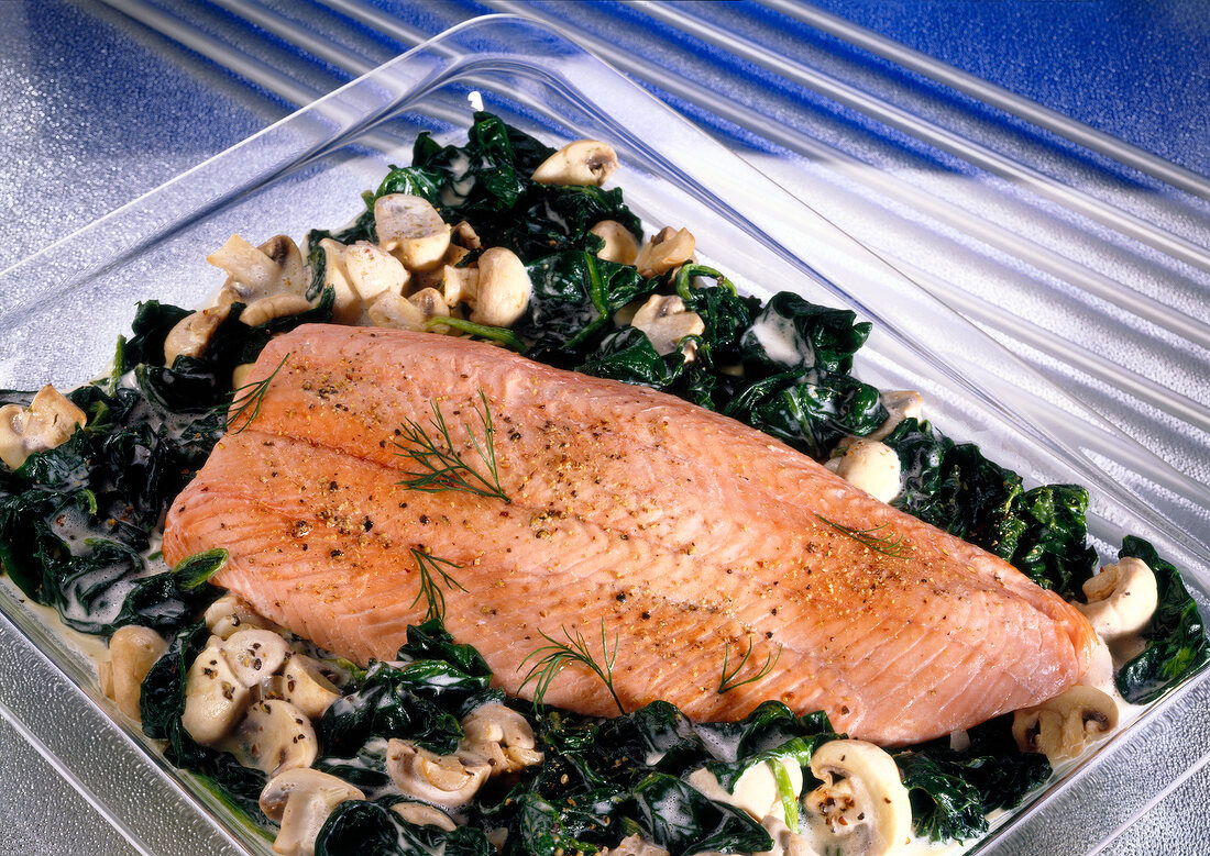 Salmon fillet on spinach and mushroom