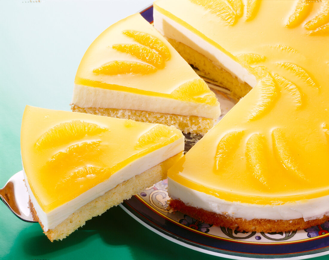 Close-up of orange cake with yoghurt cream on plate