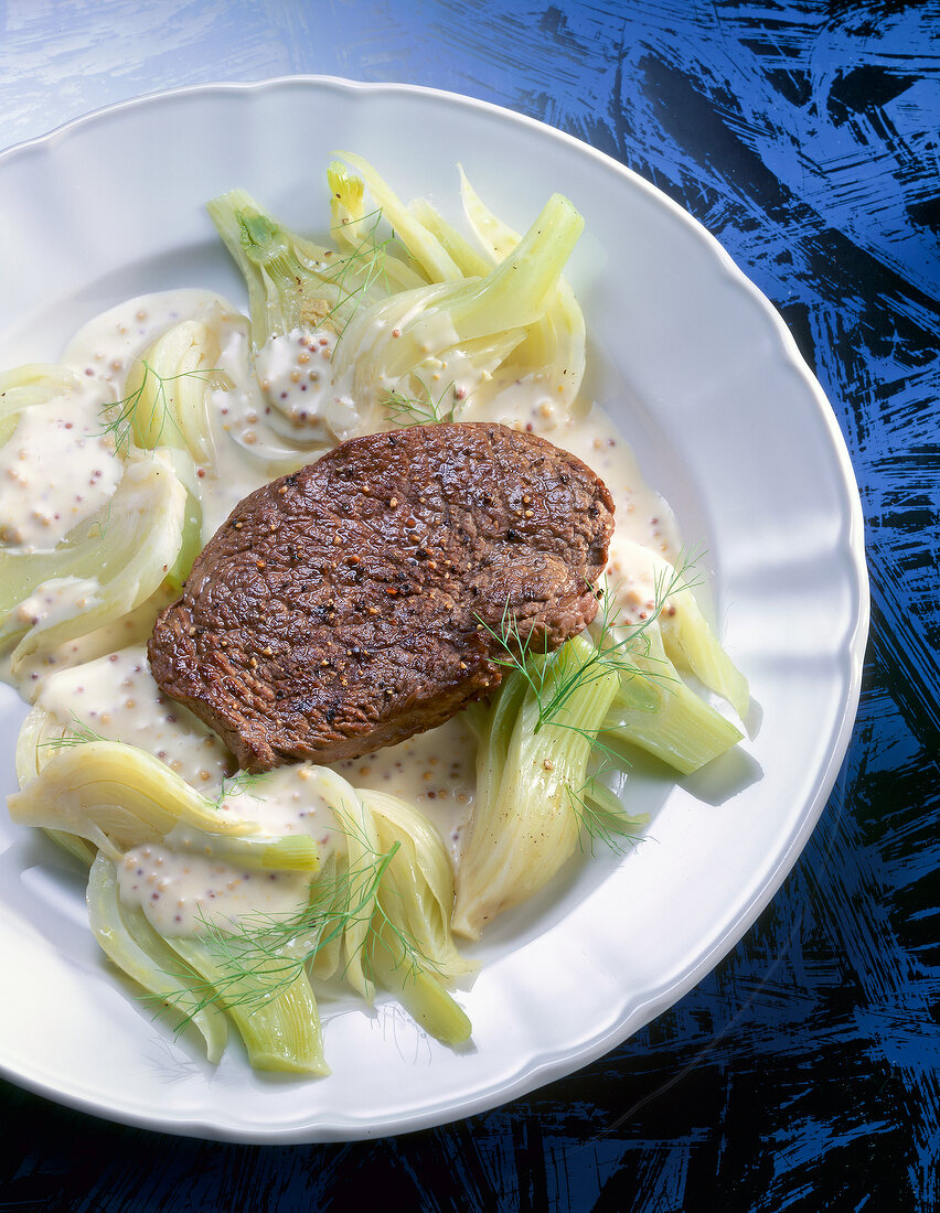 Steak with fennel on dish