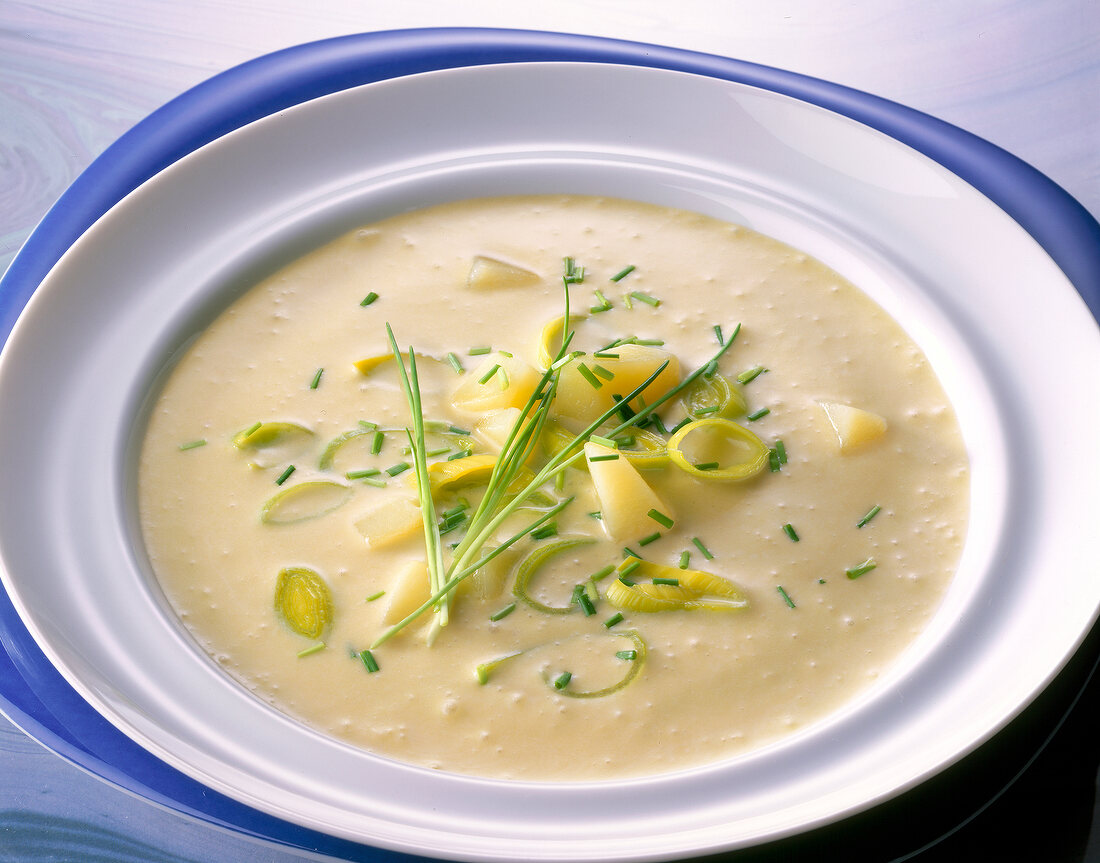 Cold soup with potatoes, leeks and chives in dish