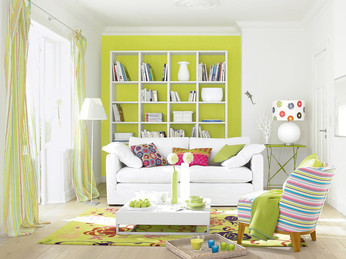 Living room with white sofa and green wall