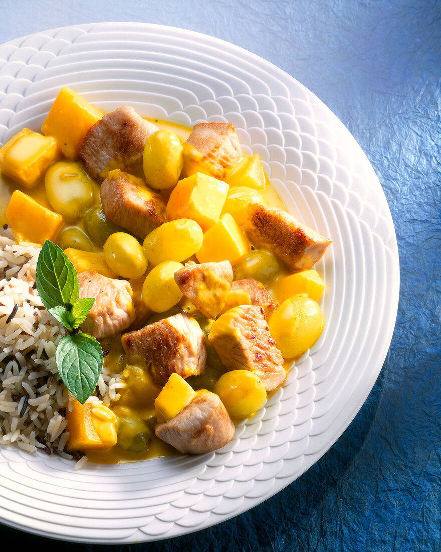 Turkey goulash with pumpkin, and wild rice on plate