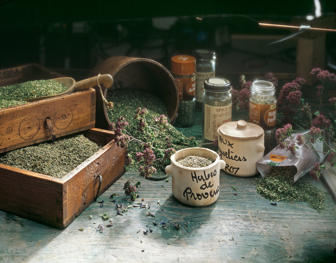 Various dried herbs in jars and boxes