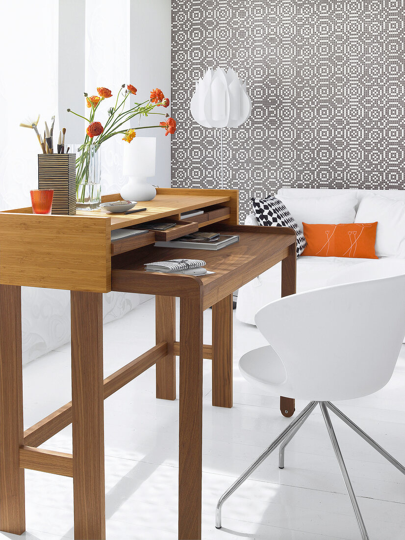 Living room with secretary desk of bamboo wood in black and white