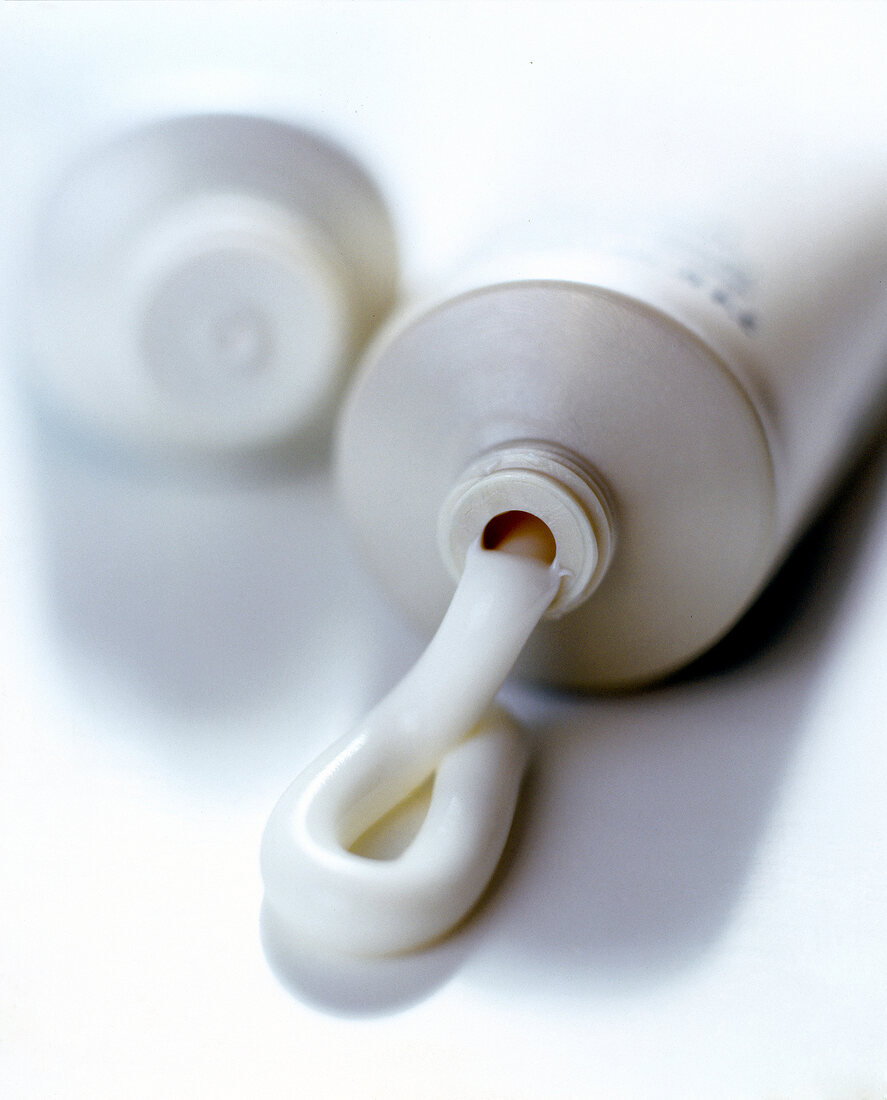 Close-up of cream squeezed out of open tube