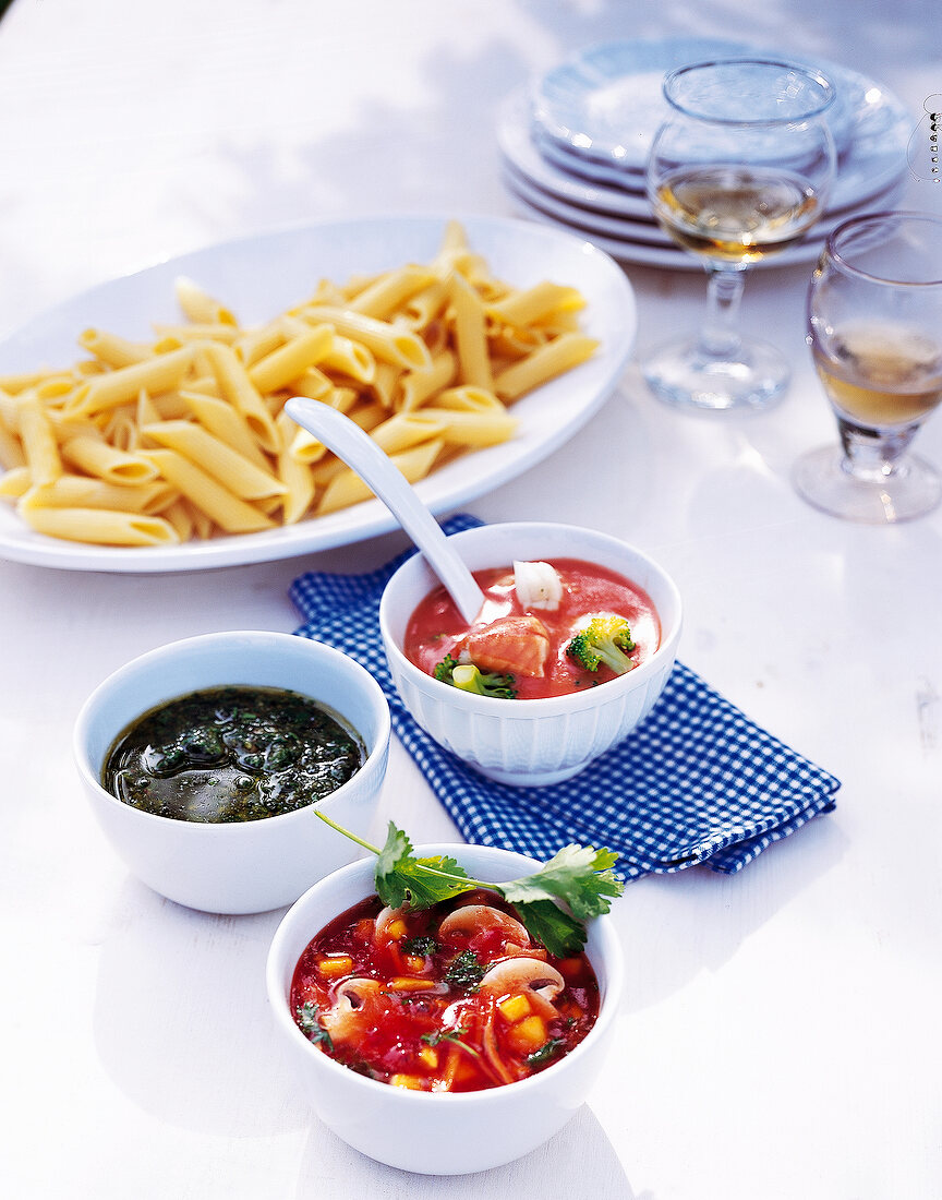 Penne pasta served with three different sauces