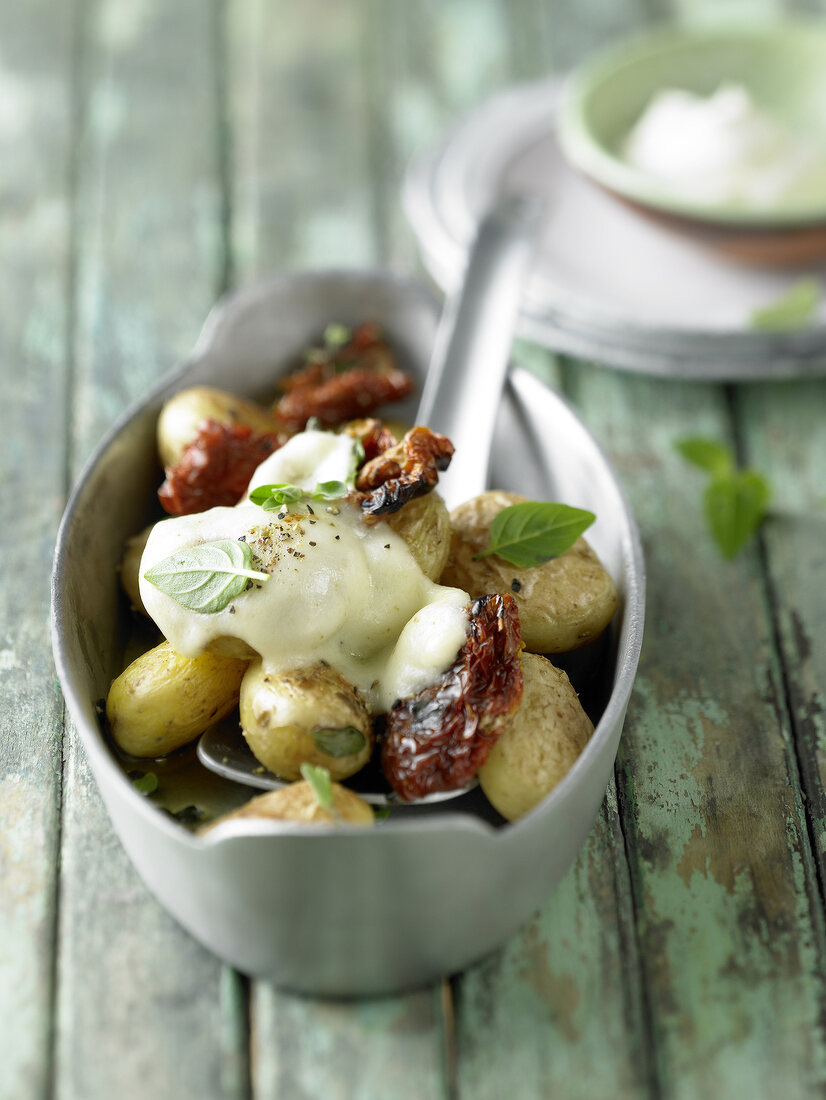 Close-up of baked potatoes with mozzarella on top