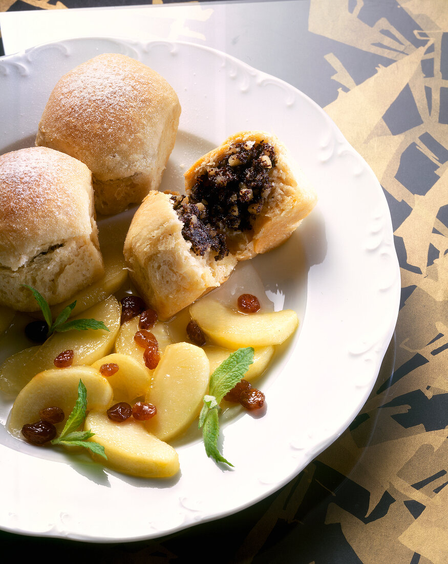 Close-up of poppy buns with apple compote in dish