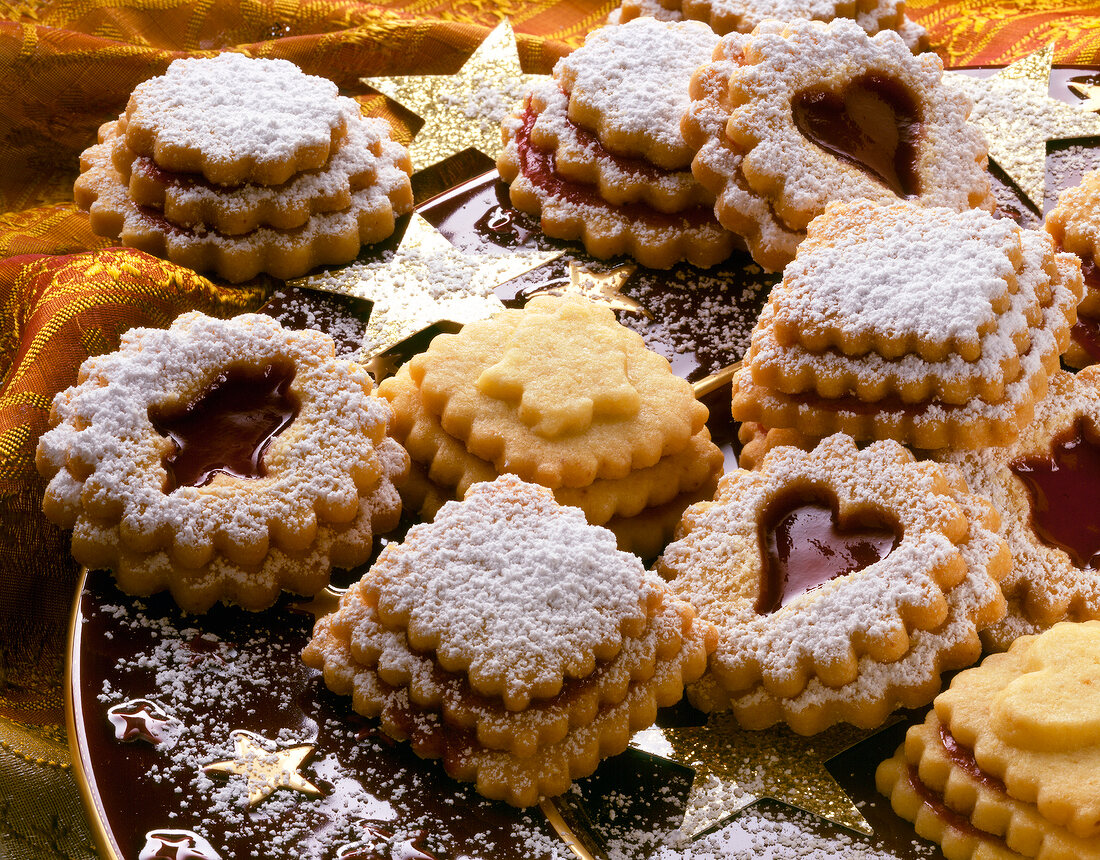 Close-up of biscuits with jam and icing sugar