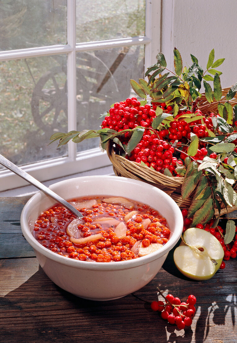 Red currants compote with apples in bowl