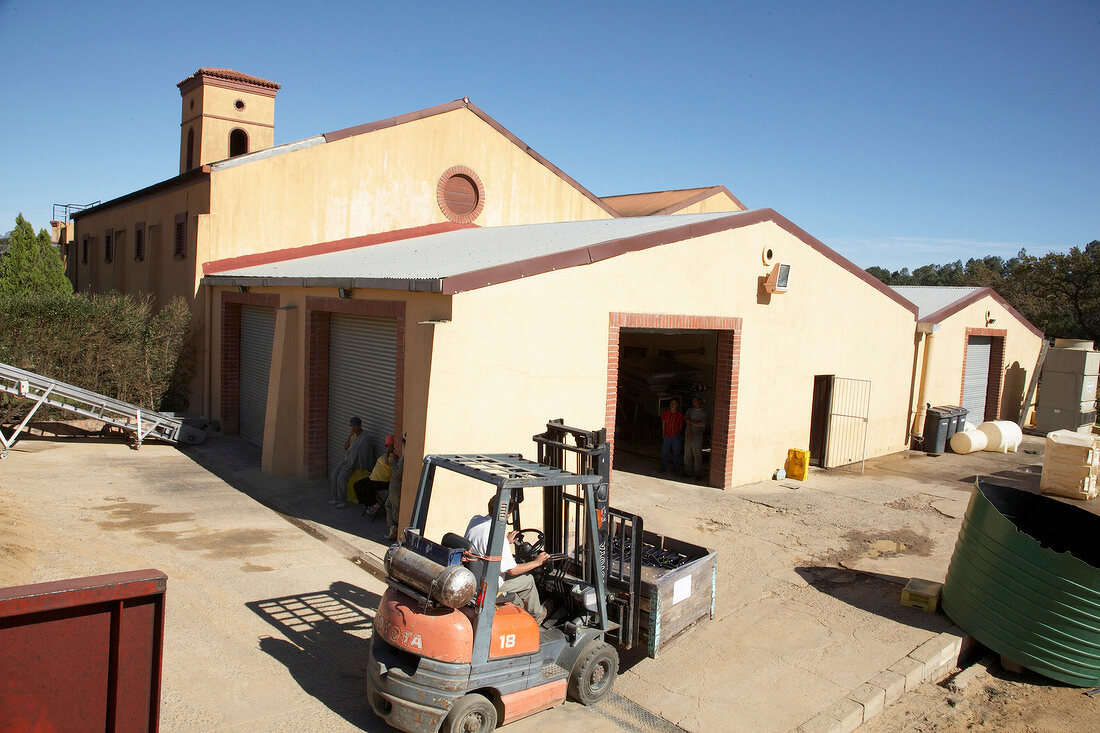 Winery warehouse and forklift at Ashanti Winery, South Africa