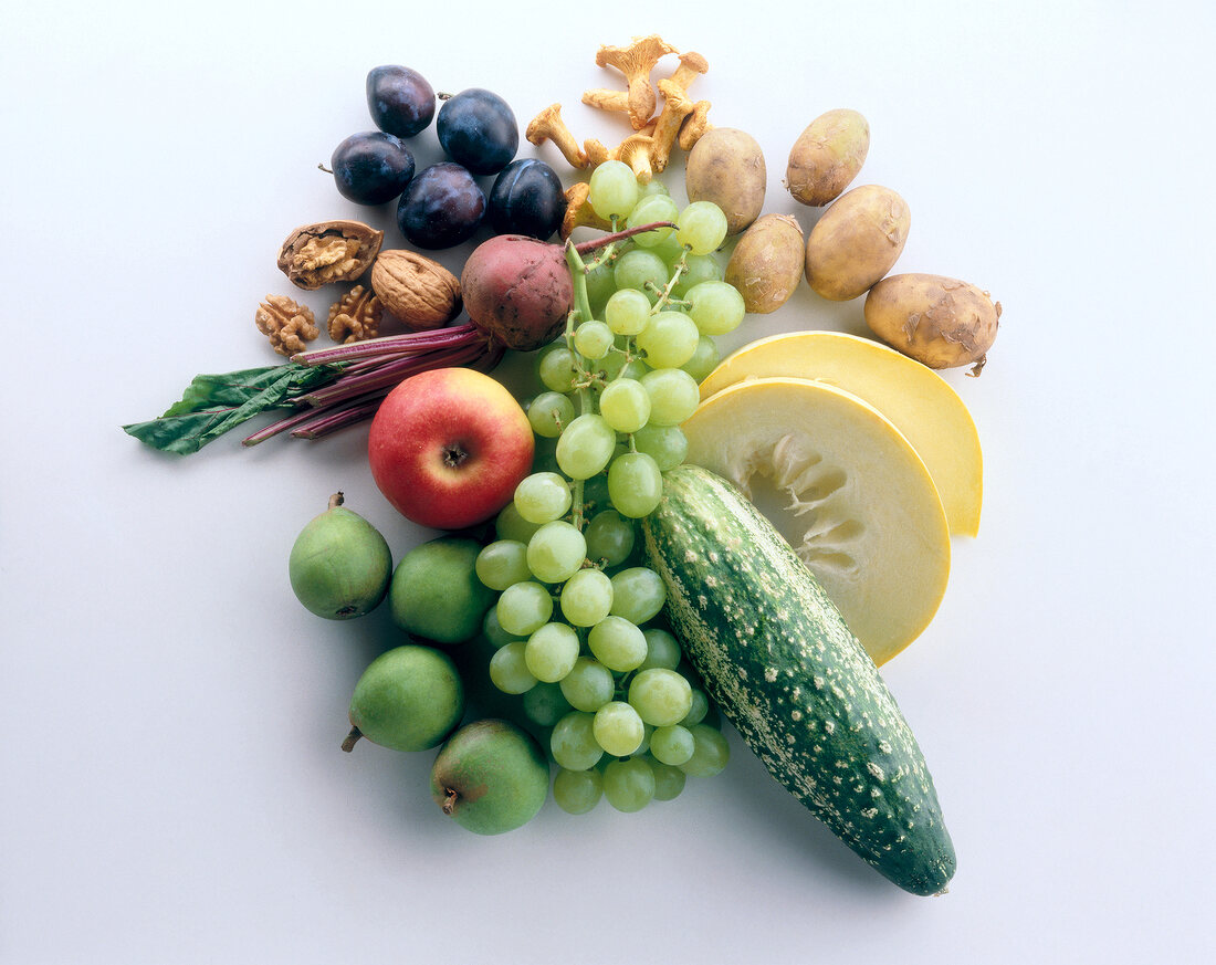 Different fruits and vegetables on white background