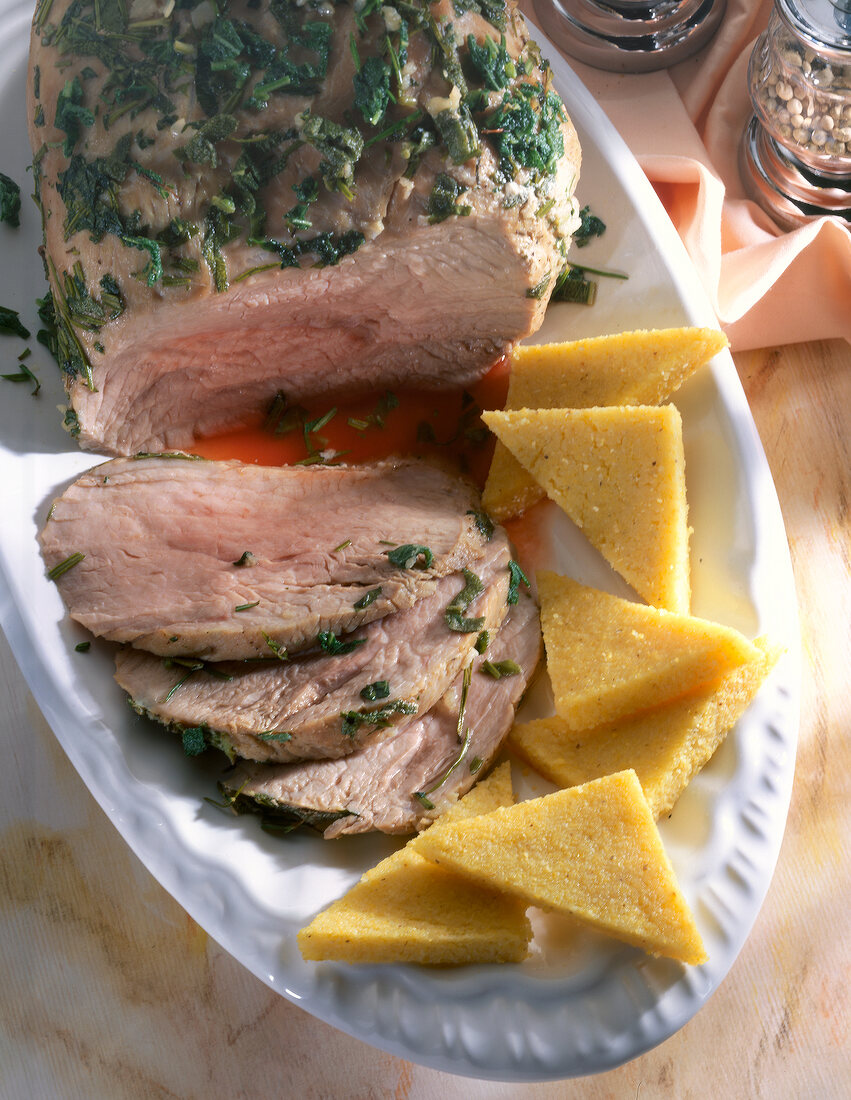 Close-up of roasted veal with polenta