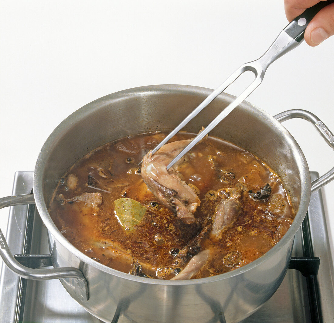 Leg stew added to mixture in pot, step 5