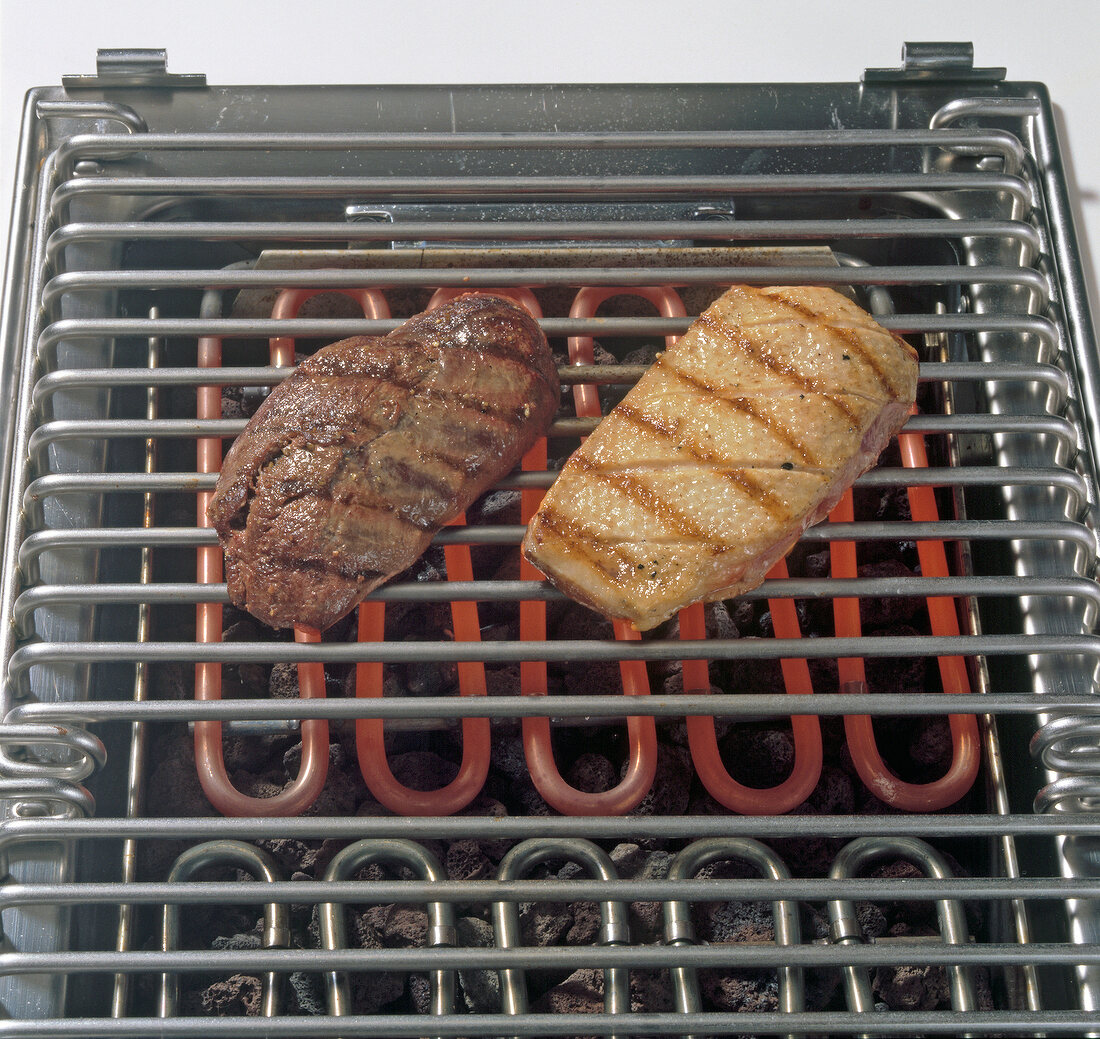 Wild duck breast being barbecued on grill, step 1