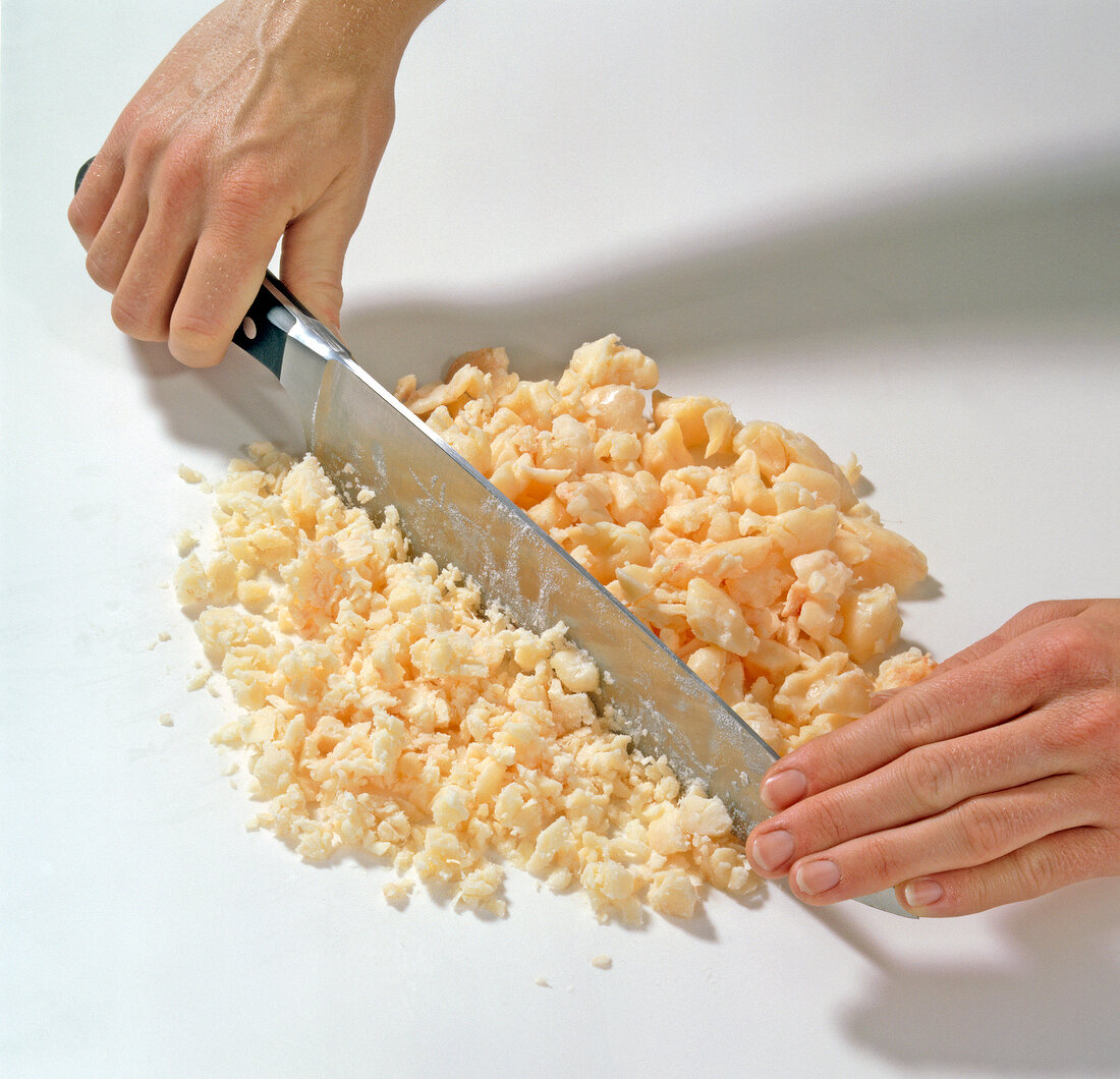 Suet being chopped for preparation of partridge pie, step 1