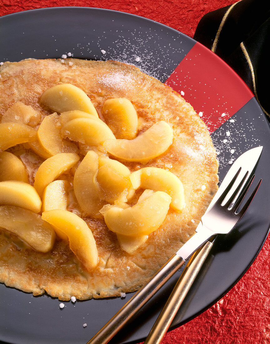 Close-up of pancakes with apple sauce