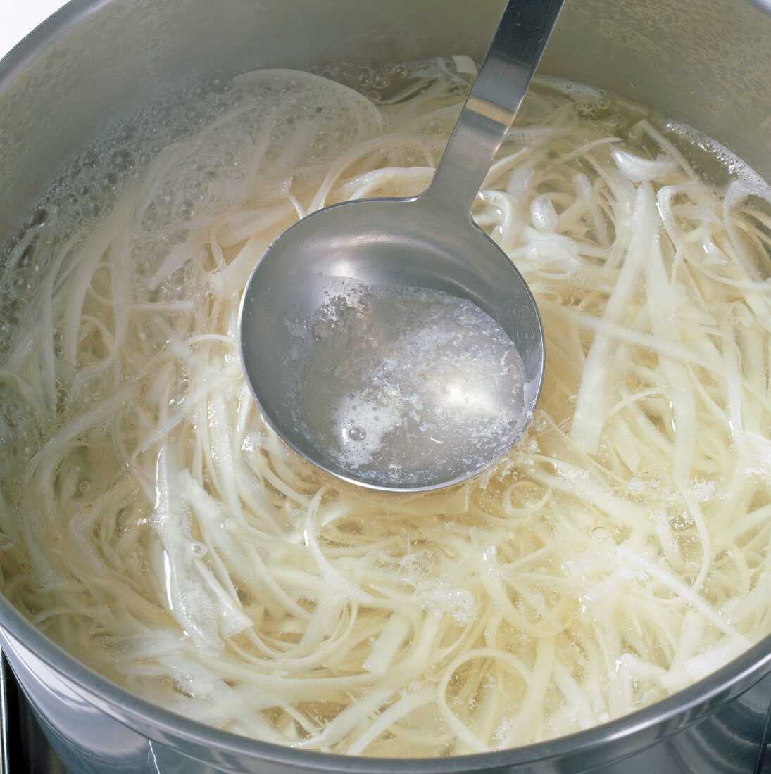 Close-up of asparagus being cooked in water, step 1