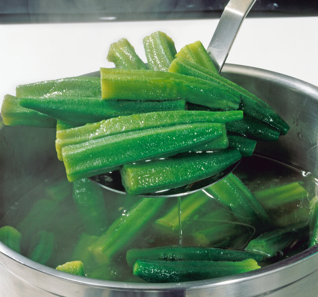 Close-up of green okra in water