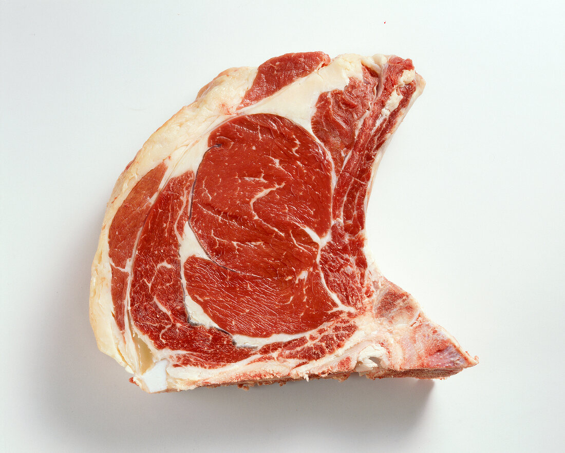 Raw beef meat from prime ribeye steak on white background
