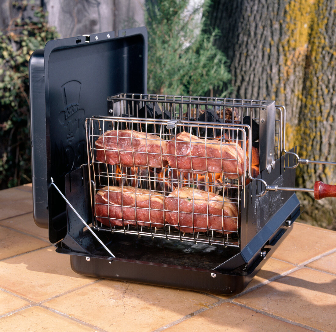 Beef and steaks in grill basket