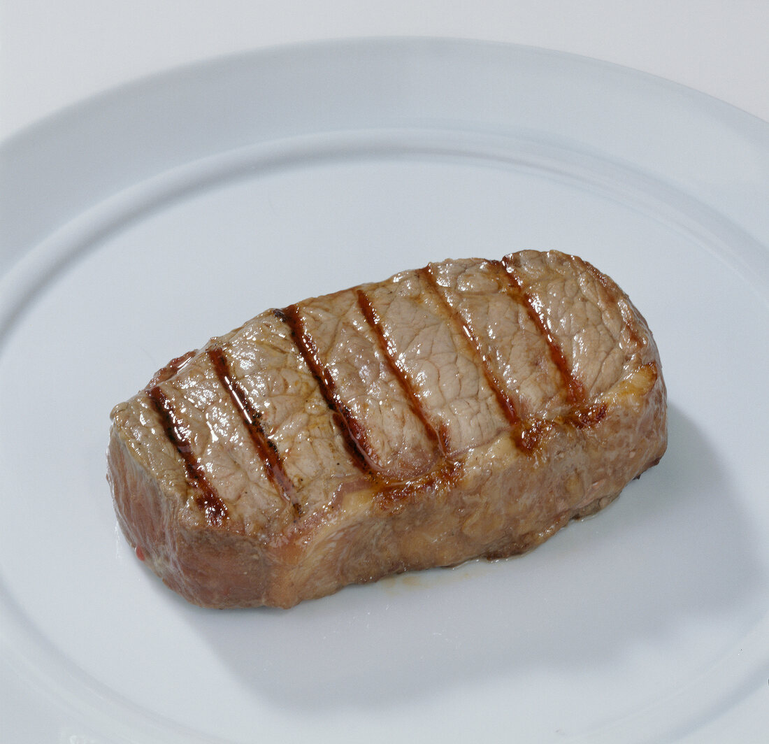 Grilled steak on plate