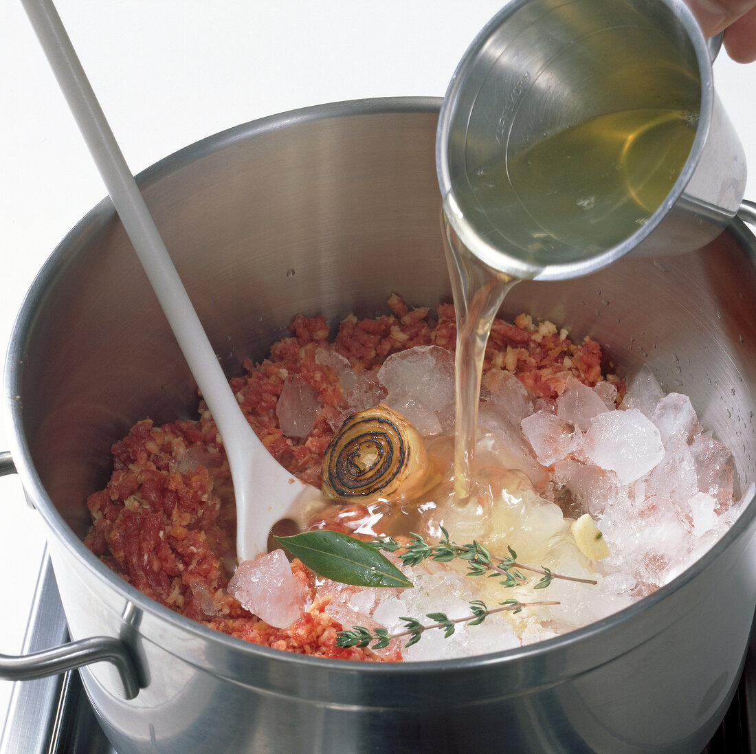 Meat, siler root and ice cubes in cooking pot, step 5