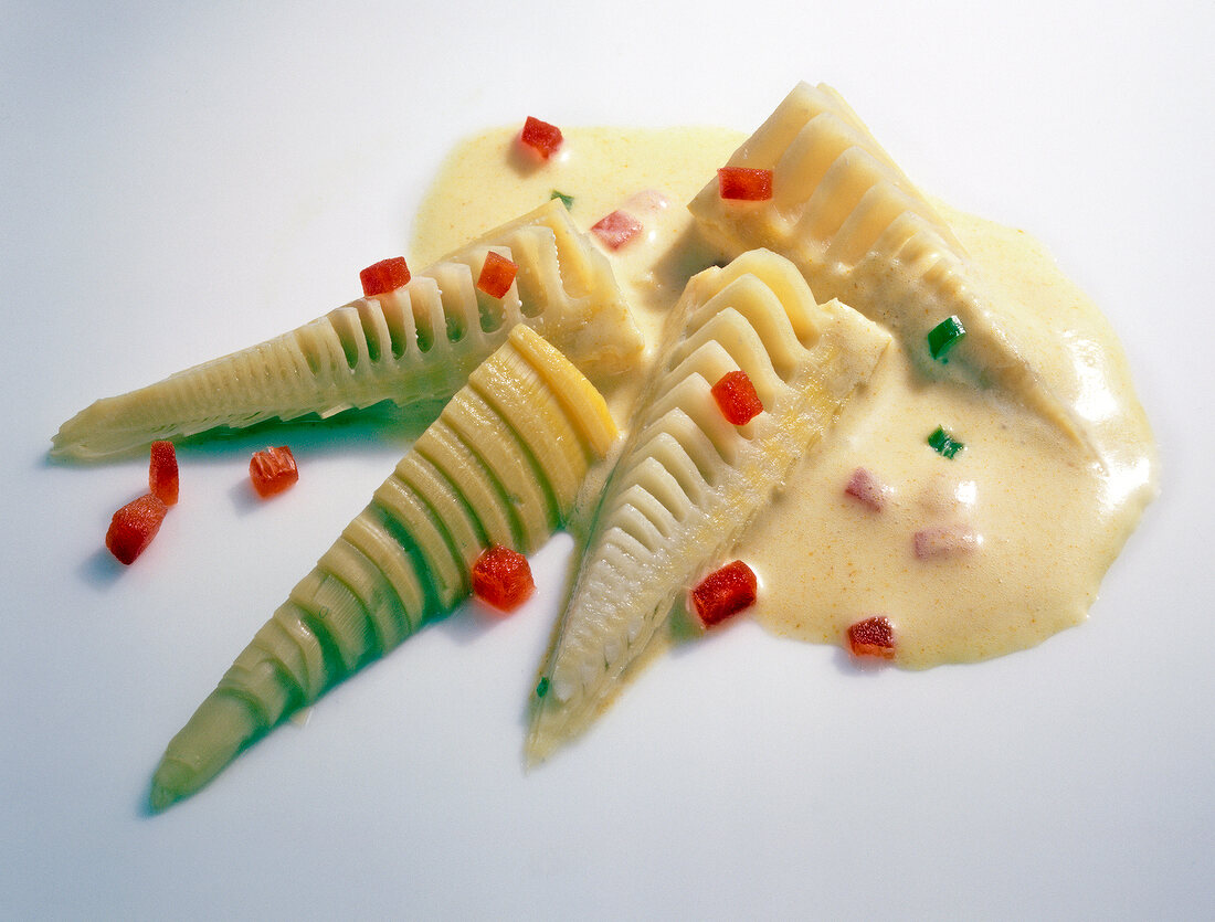 Close-up of bamboo shoot salad with coconut dressing and curry