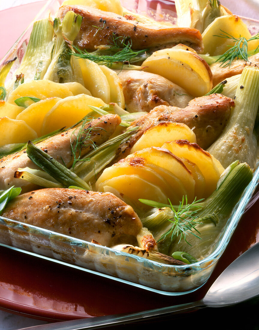 Close-up of fennel gratin with chicken breast and vegetables in dish