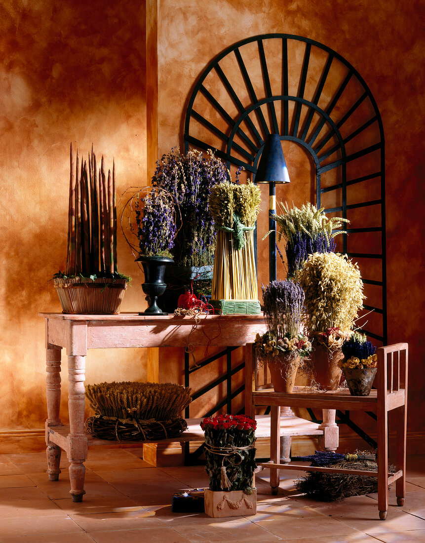 Variety of bouquets and grass on table